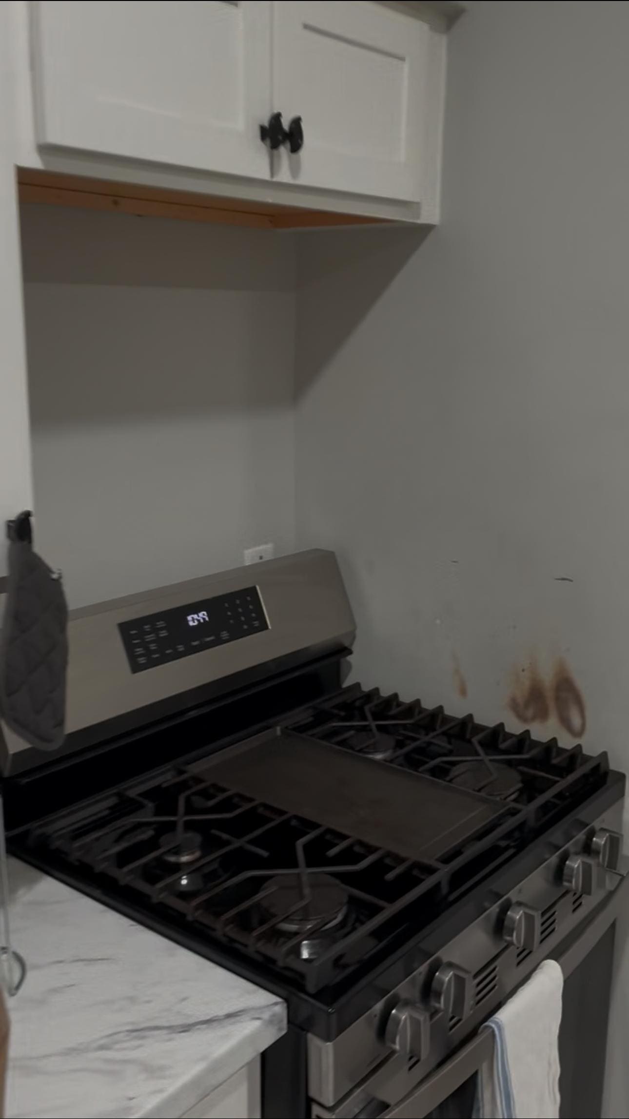 Burn marks on stove wall
