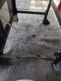 You can see the melted plastic mat under the grill. We were unable to use this.