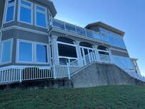 The back of the home directly overlooking the lake