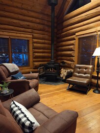 Downstairs living room with a wood burning stove.