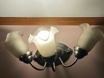Multiple light fixtures without working bulbs.
