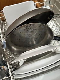 Dirty pots and dishes found in kitchen.