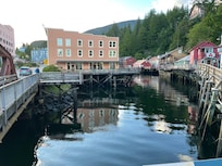 Hotel is salmon-colored building on the left.