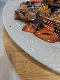 Flies under plastic wrap. Sheraton this is gross. If you had an issue with flies. You should have done individually packaged items. The front staff and kitchen staff were aware of the bug problem .
