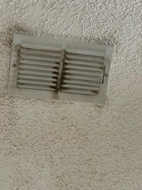 Dirt on ceiling around ventd