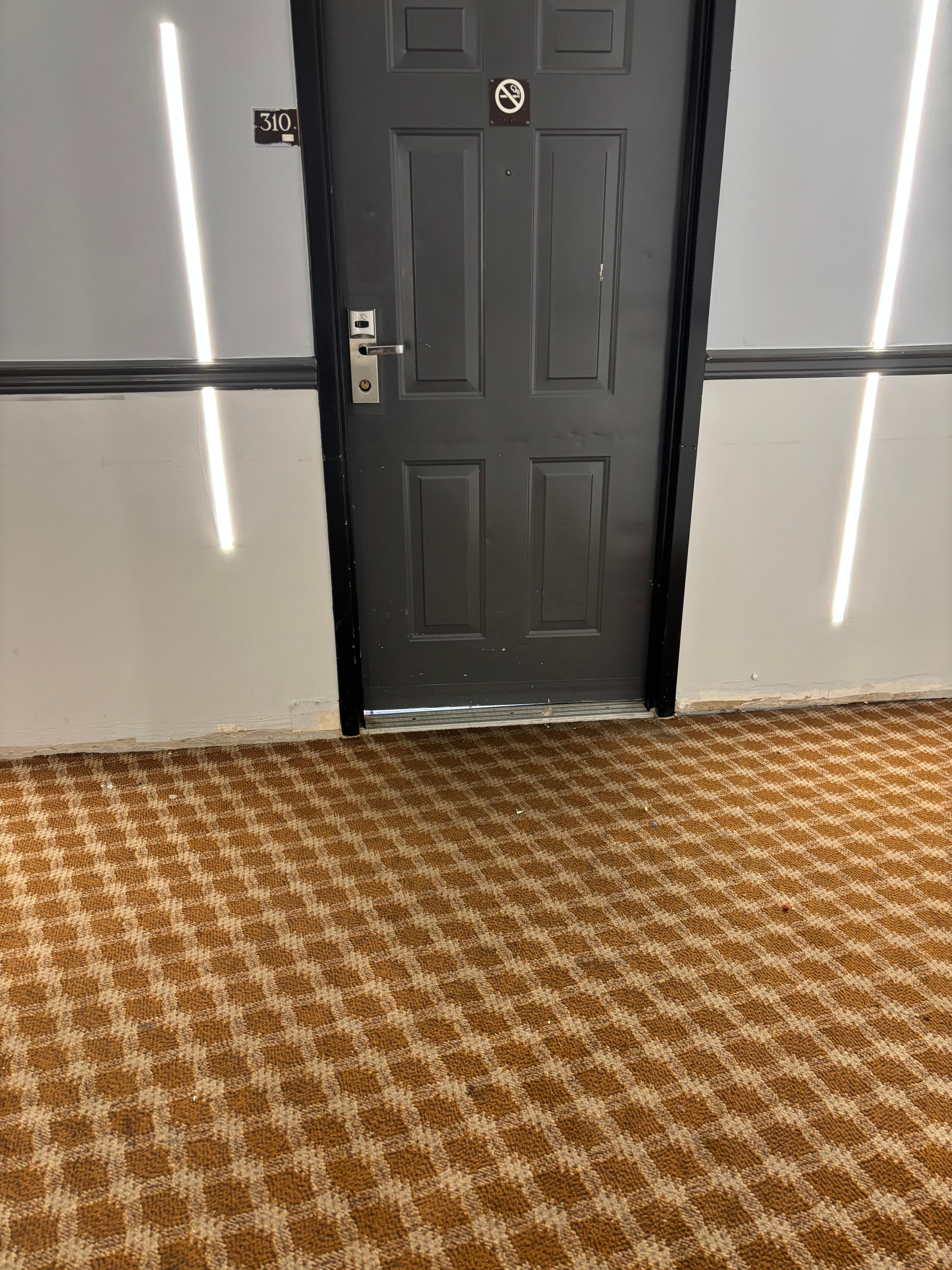 Gap under the door made every noise in the hallways audible.