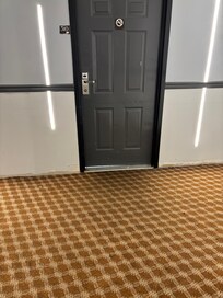 Gap under the door made every noise in the hallways audible.