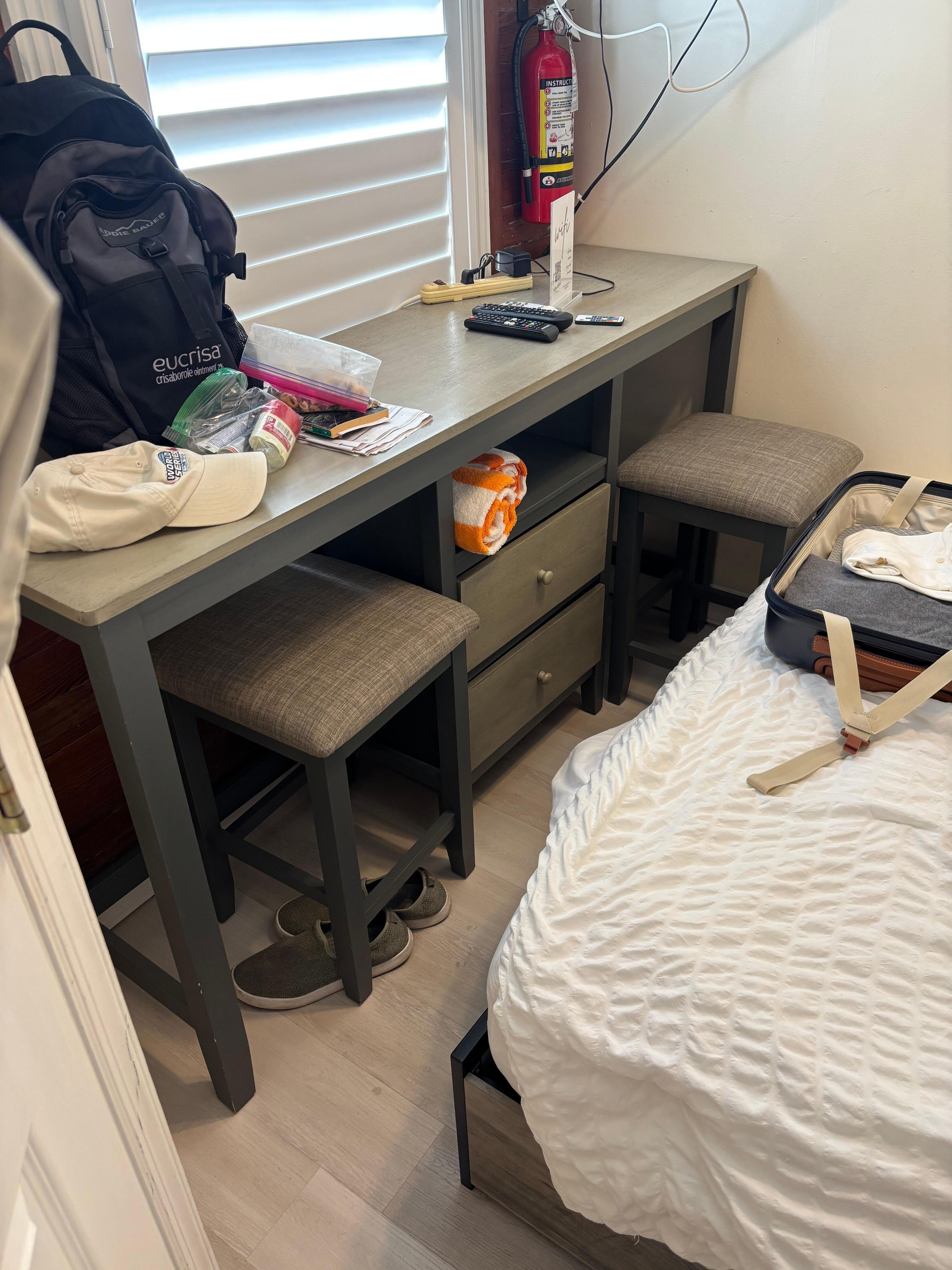 It is impossible to get in between the bed (sagging mattress) and this counter top and actually pull out the stools. Forced to sit on the bed to eat.