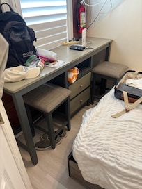 It is impossible to get in between the bed (sagging mattress) and this counter top and actually pull out the stools. Forced to sit on the bed to eat.
