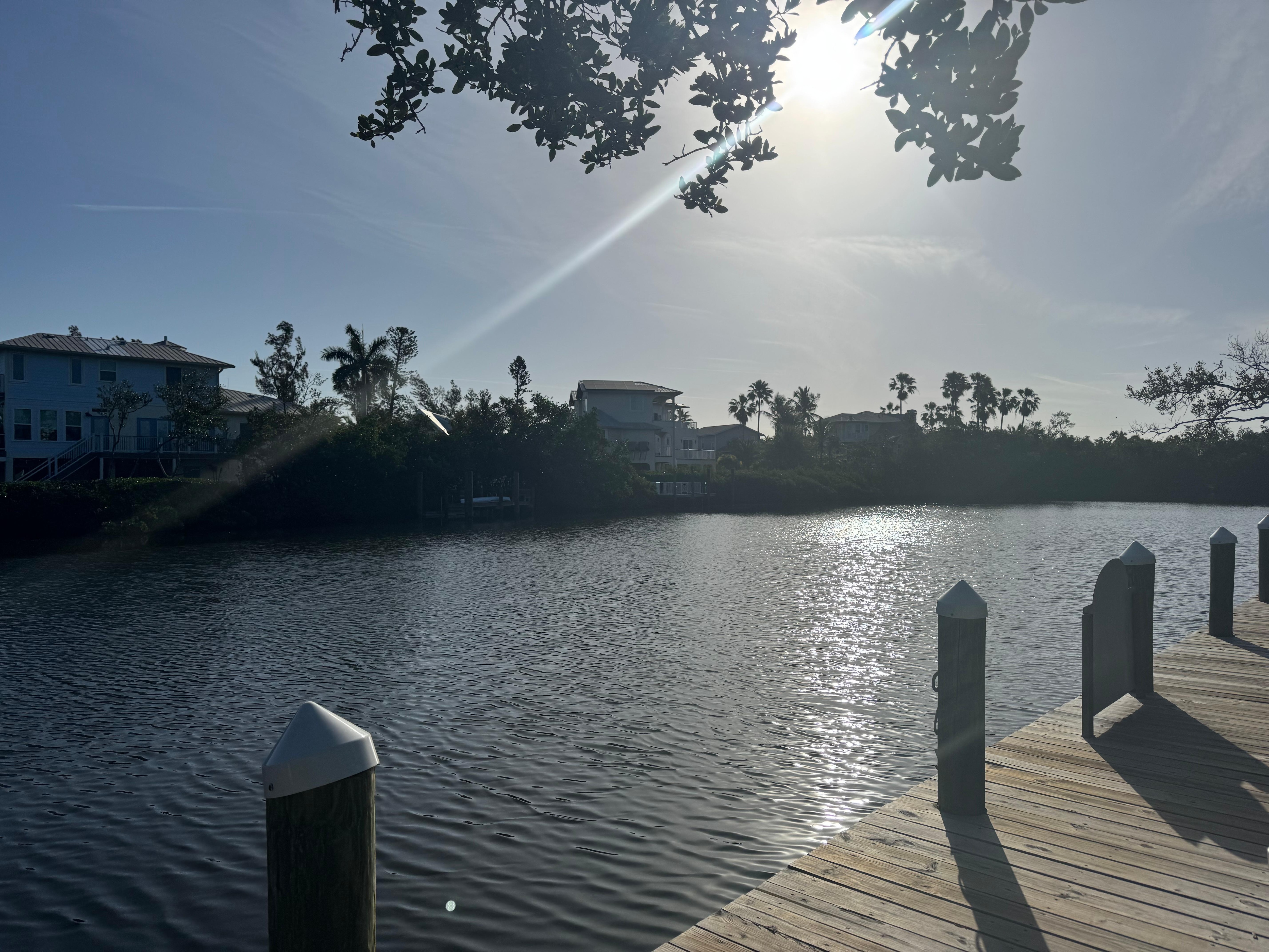 Water view outside the private porch, shared deck with 2 round picnic tables and 4 tall chairs 