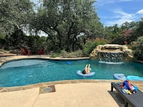 The pool was large with a mermaid cove and bench under the waterfall. There is a nice sunning ledge and a bench in the deeper end of the pool to relax on. Plenty of pool decking for chairs and sunbathing. Such a great space!