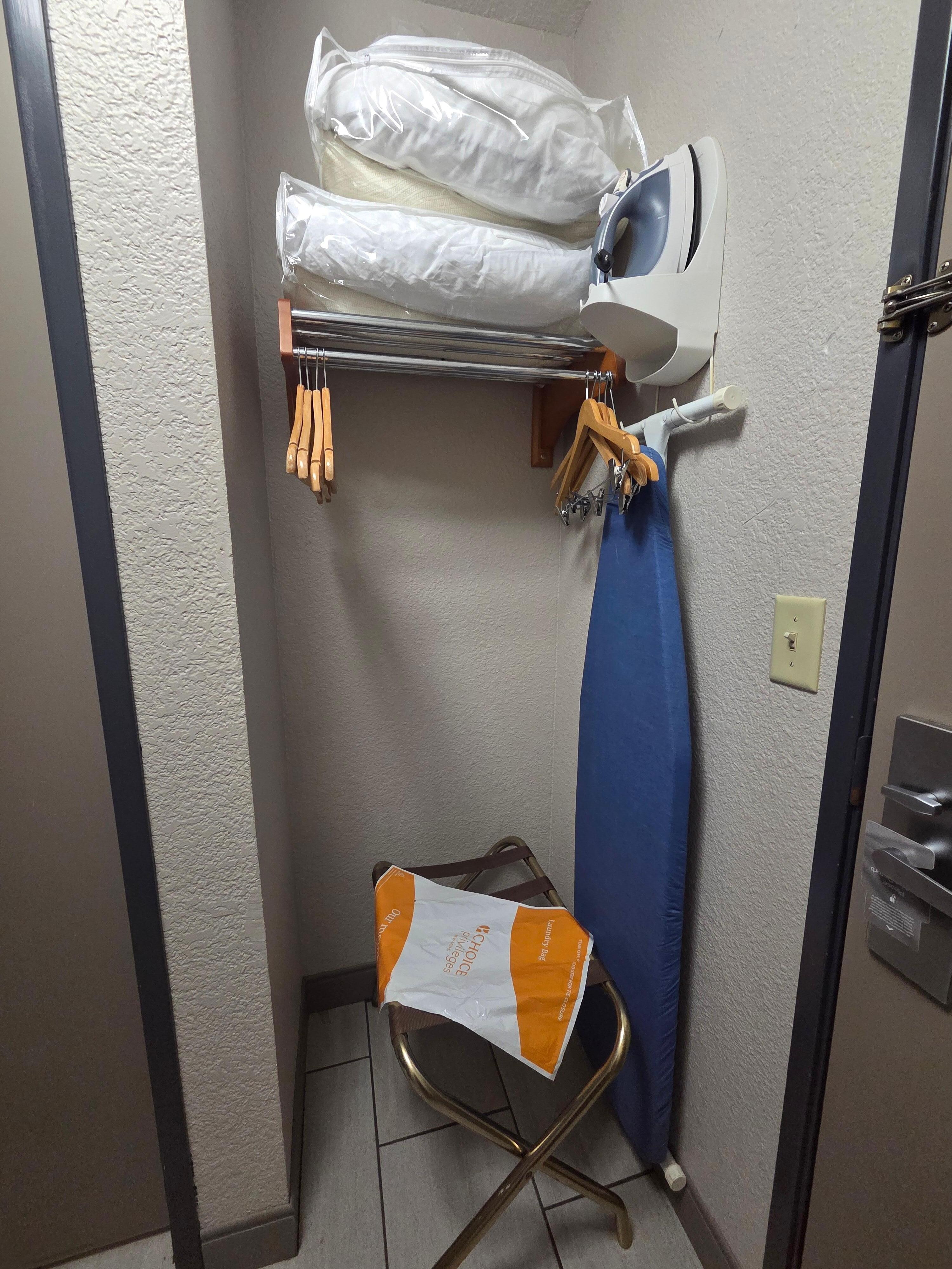 Closet w/ extra linens and laundry bag. 
