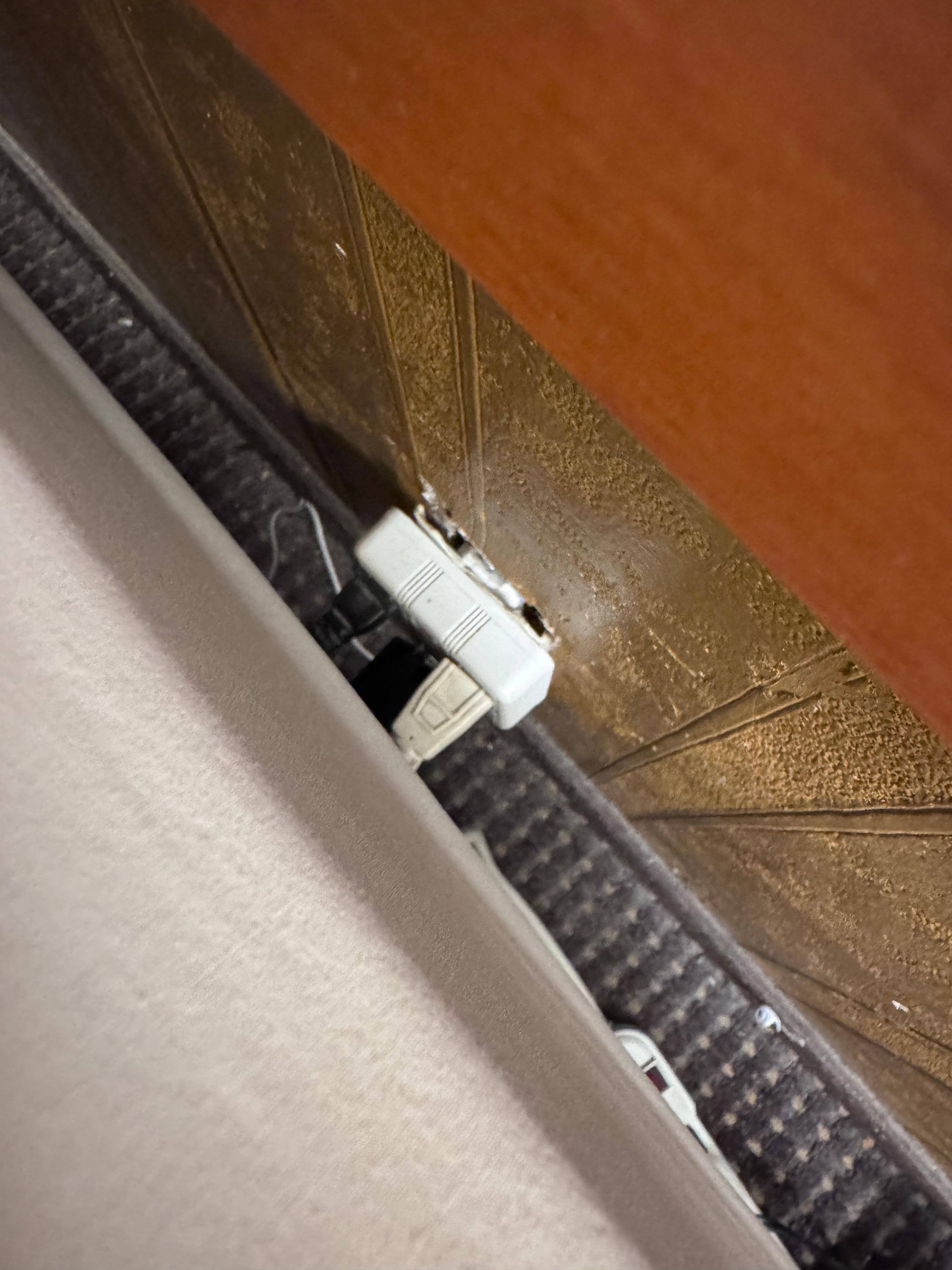Plug in hanging out of the wall behind my bed