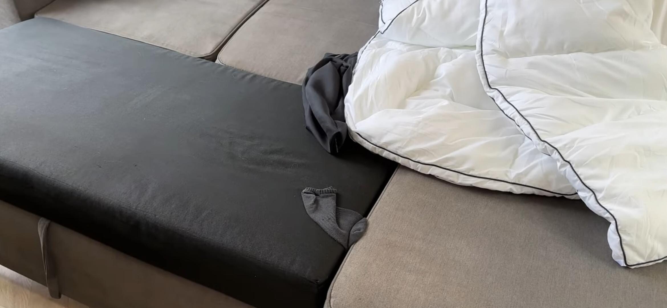 Someone's dirty socks under our bedding