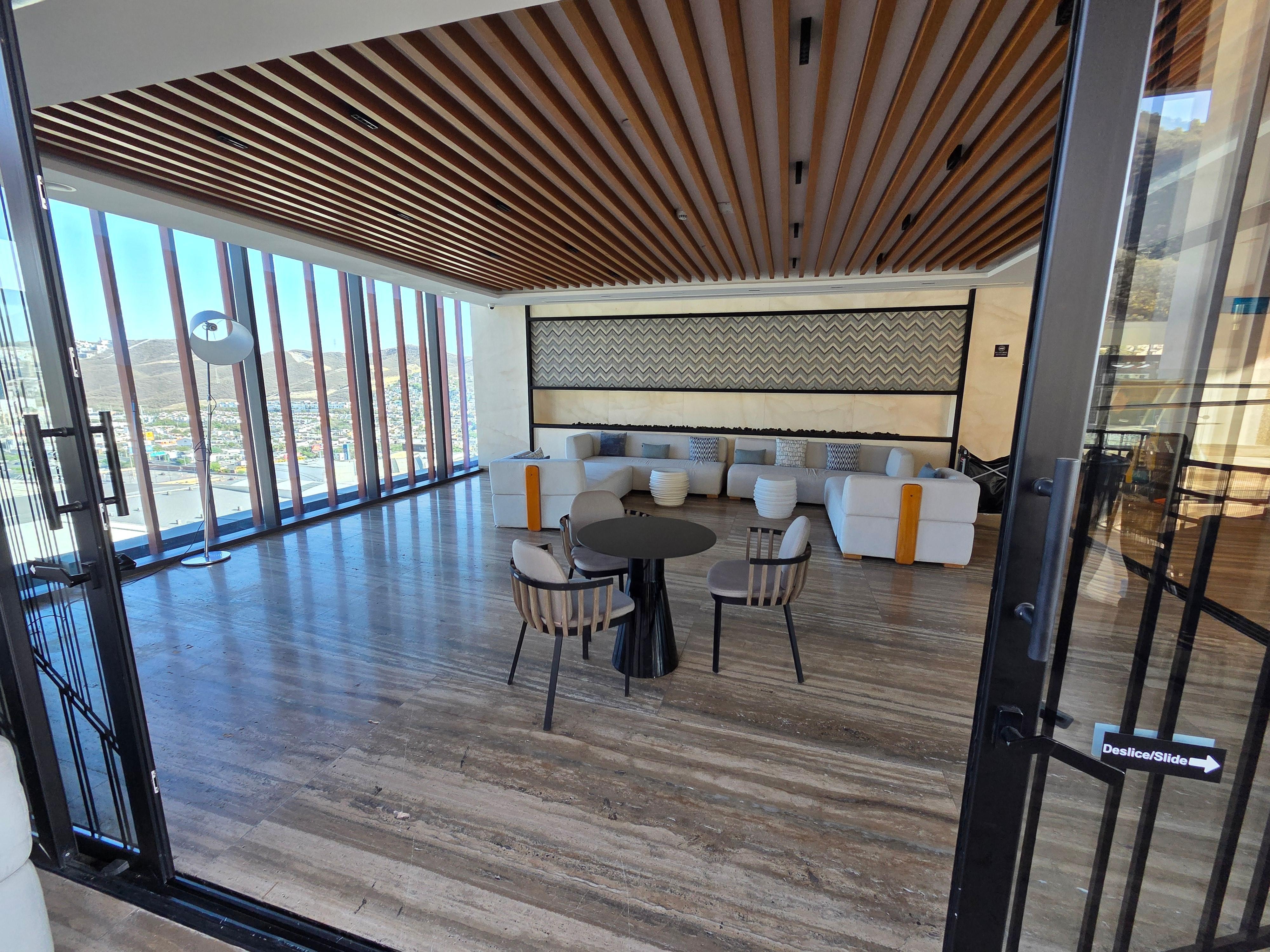 Restaurant by pool and lounge area