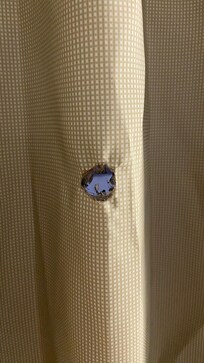 Hole in curtain