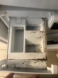 Dispenser of washing machine where detergent goes.