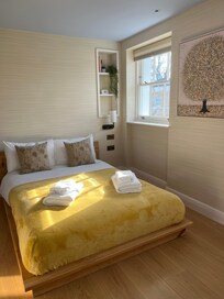 One of 2 top floor bedrooms, with full and half bath on the same floor.