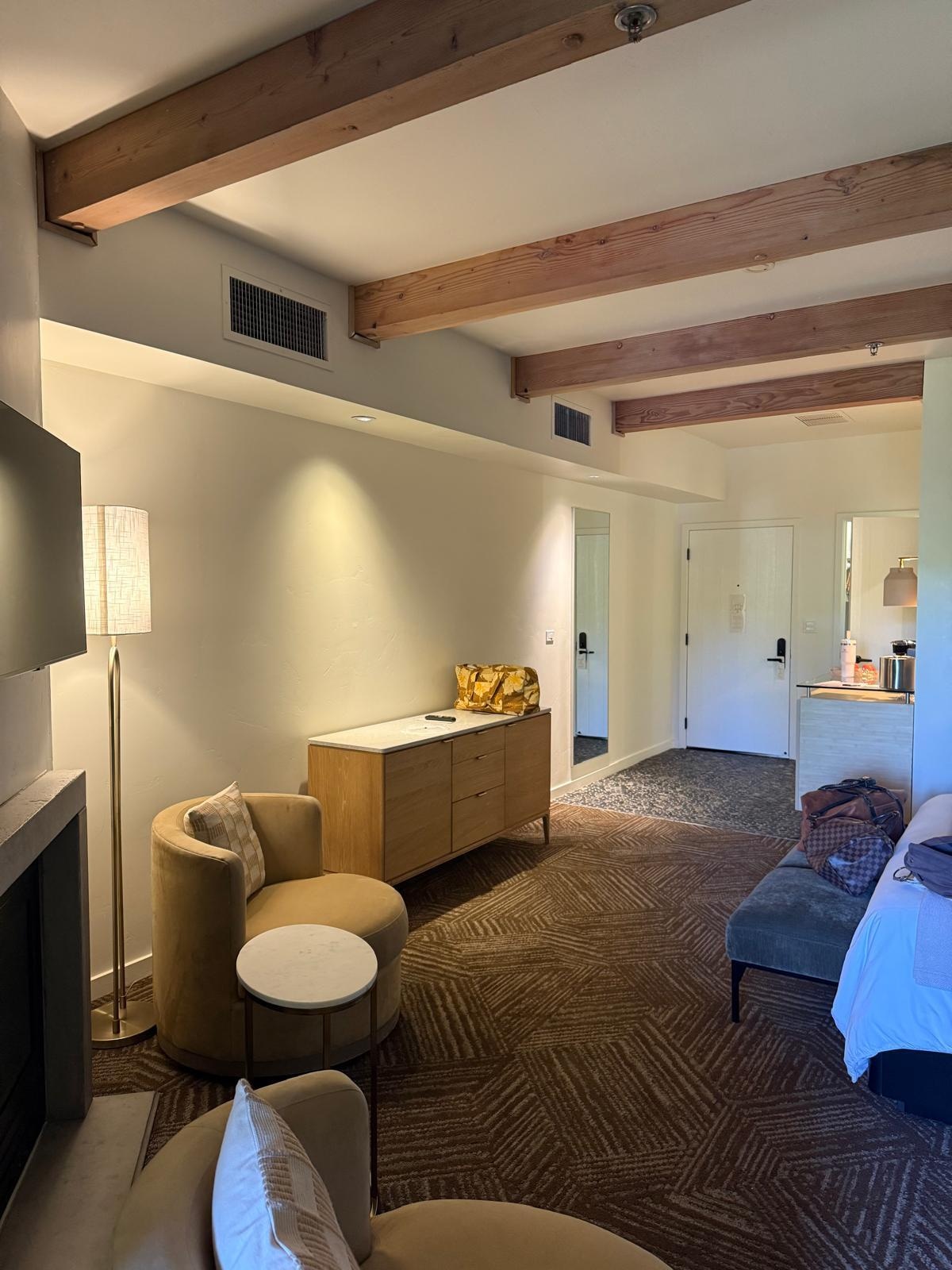 A king-sized bed accompanied by a fireplace.