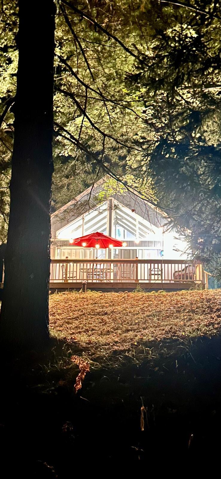 The front of house at night. 