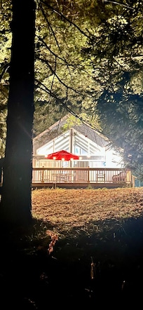 The front of house at night.