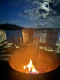 Sitting around the fire enjoying views of the lake.