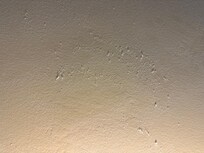 When we touched the wall, it was caked with accumulated dust