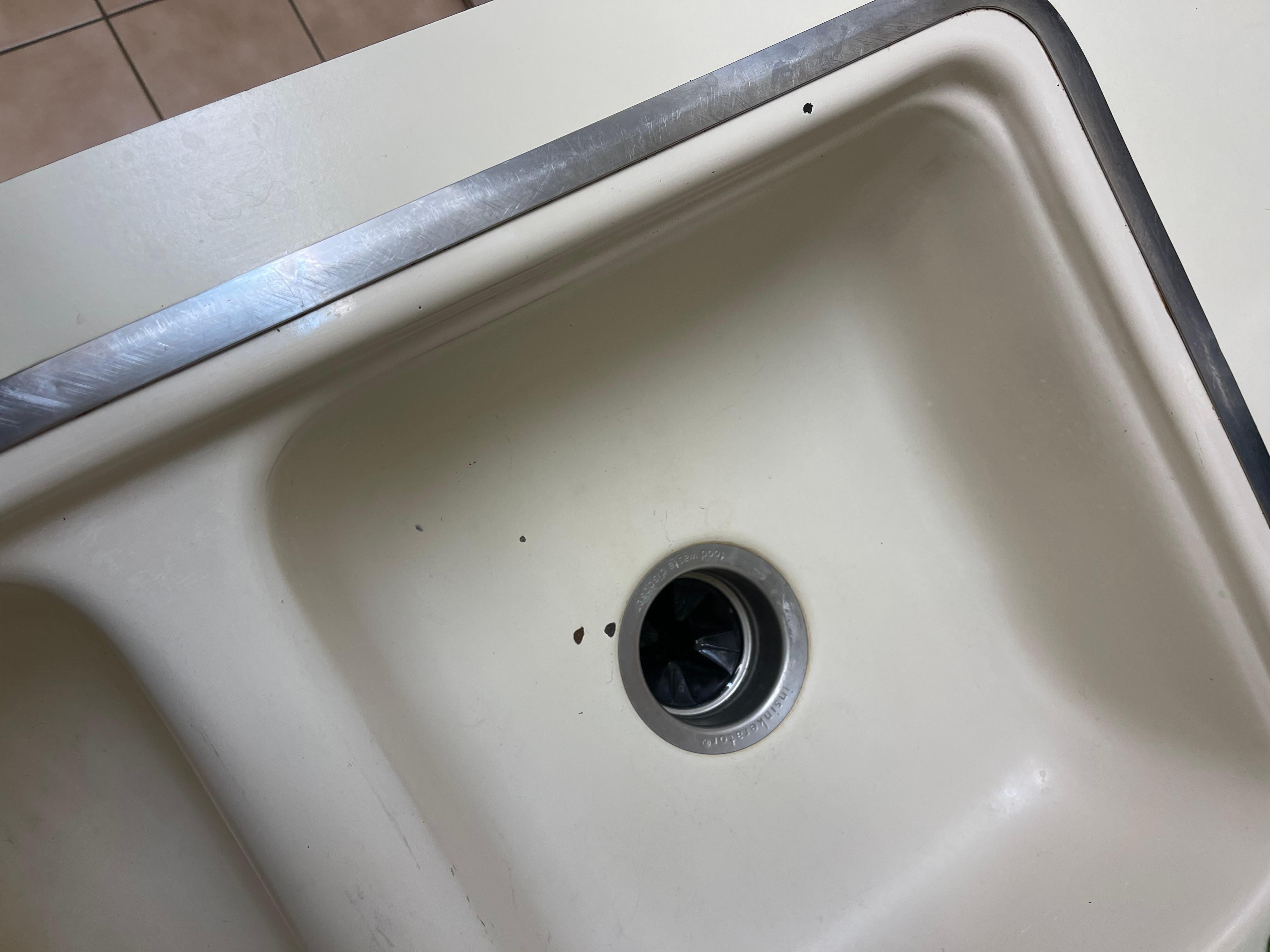 Unsightly chips in sink and countertop 