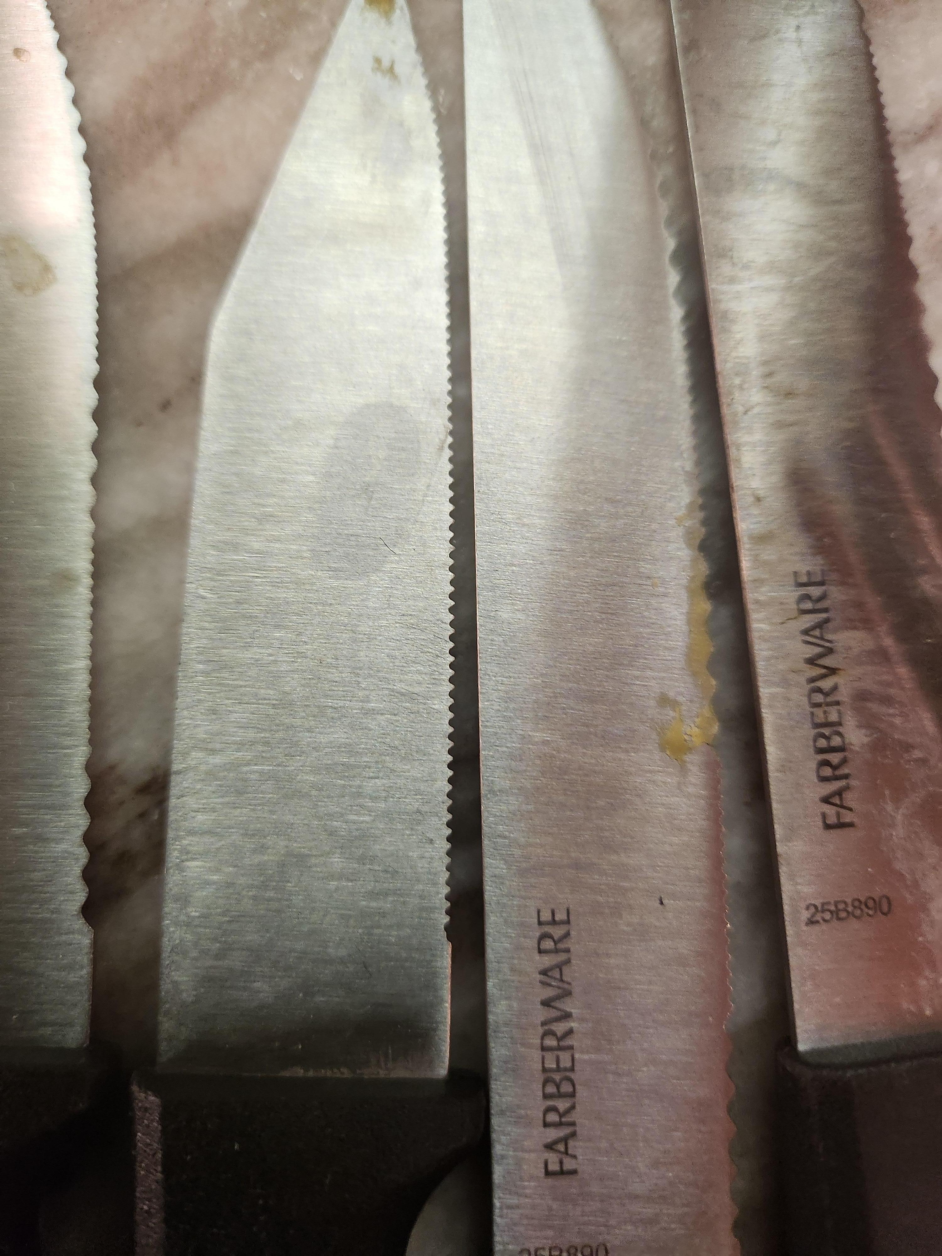 Food struck on knives in drawer