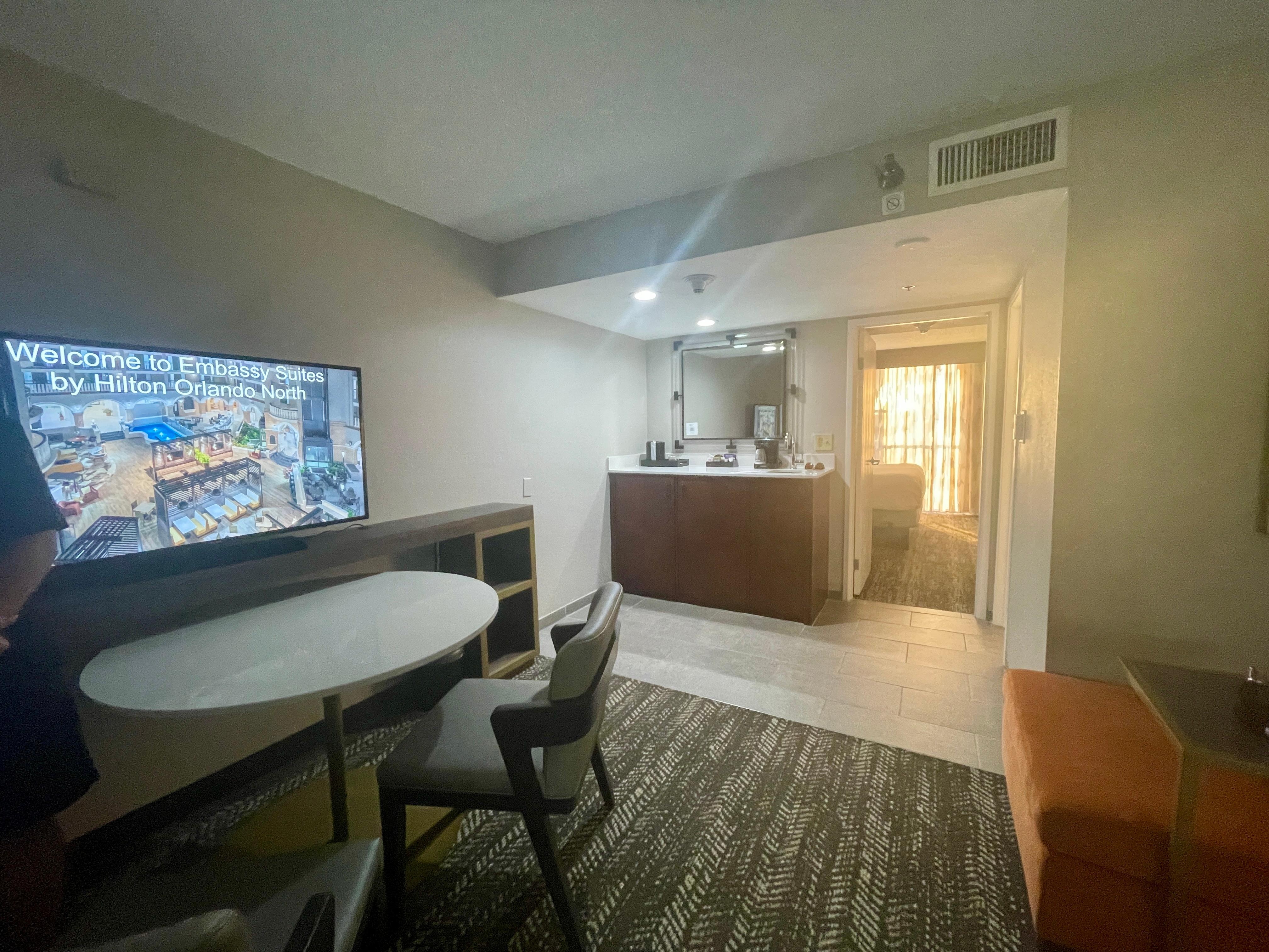 Living space with sink, fridge and microwave 