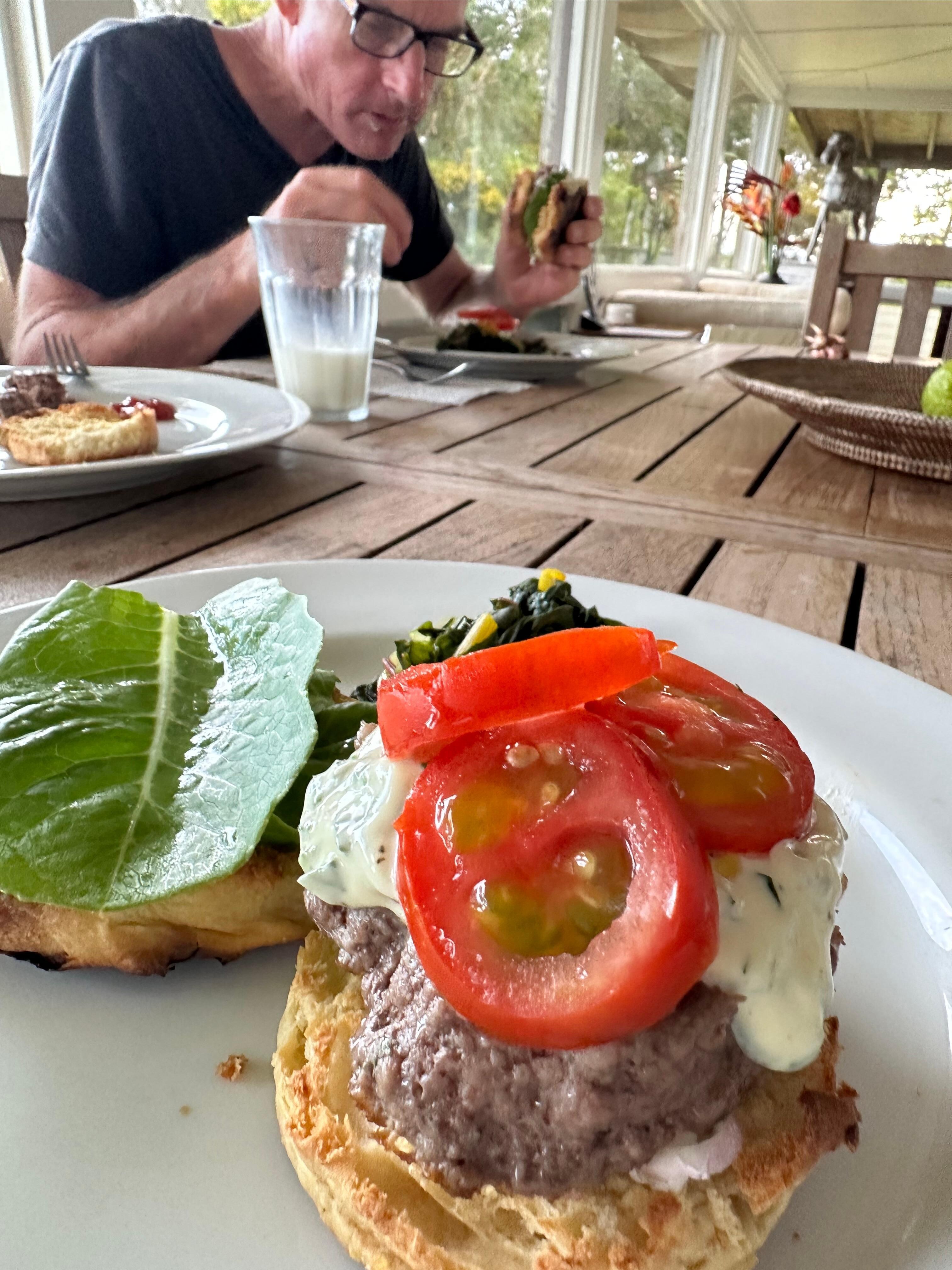 Venison burgers (on my homemade English muffins), garden herb mayo, tomatoes, lettuce and sautéed Swiss chard. Hyper local meal made easy at the ranch.