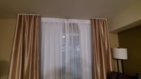 Real curtain on the side of window