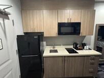 Photo shows kitchen space available in most rooms.