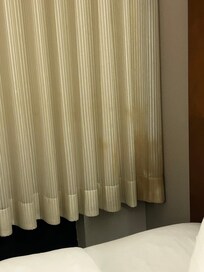 UGLY soiled spot in curtains that could’ve been washed, but should’ve been REPLACED if spot wouldn’t come out!