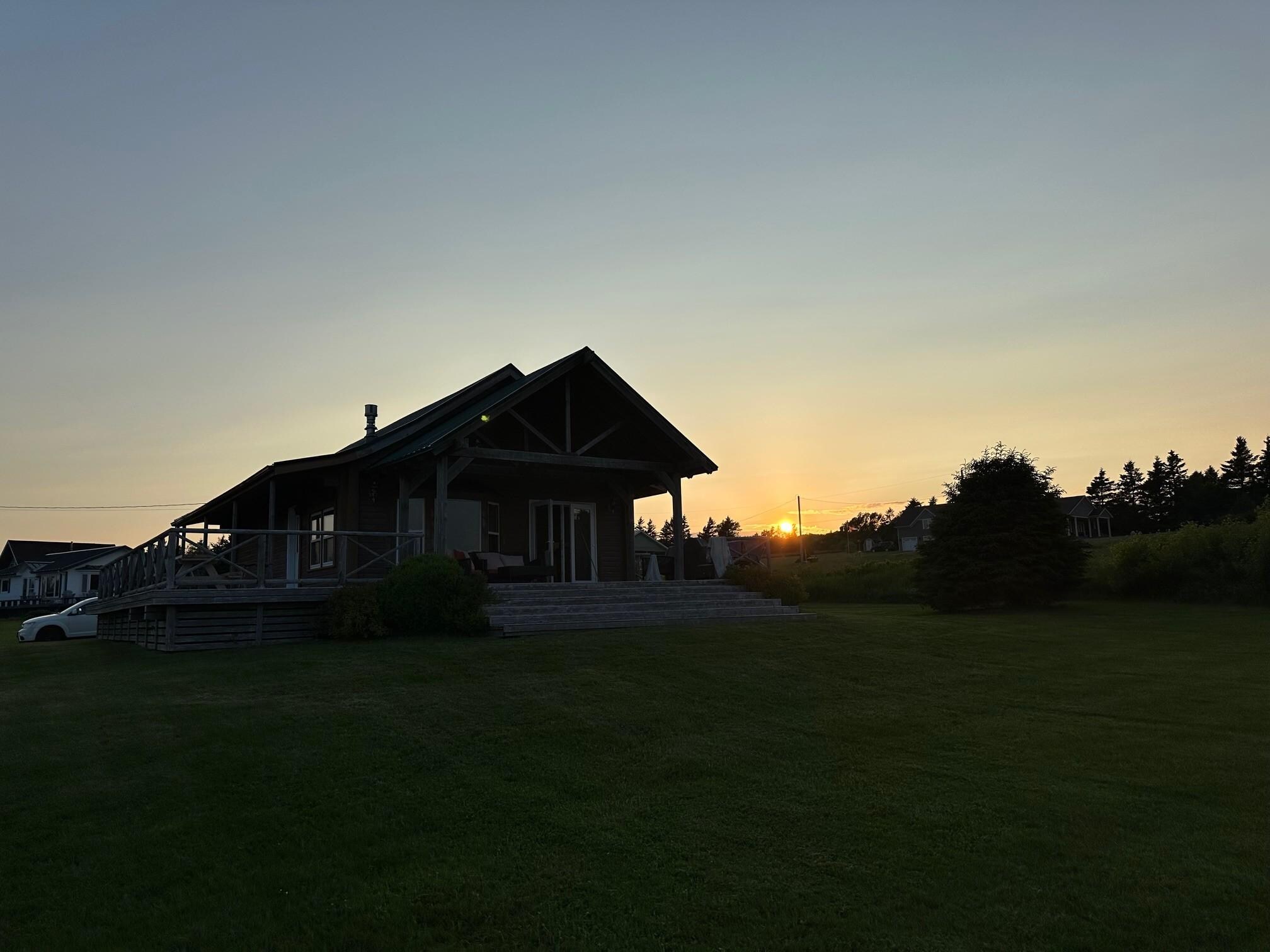 Sunset behind cottage