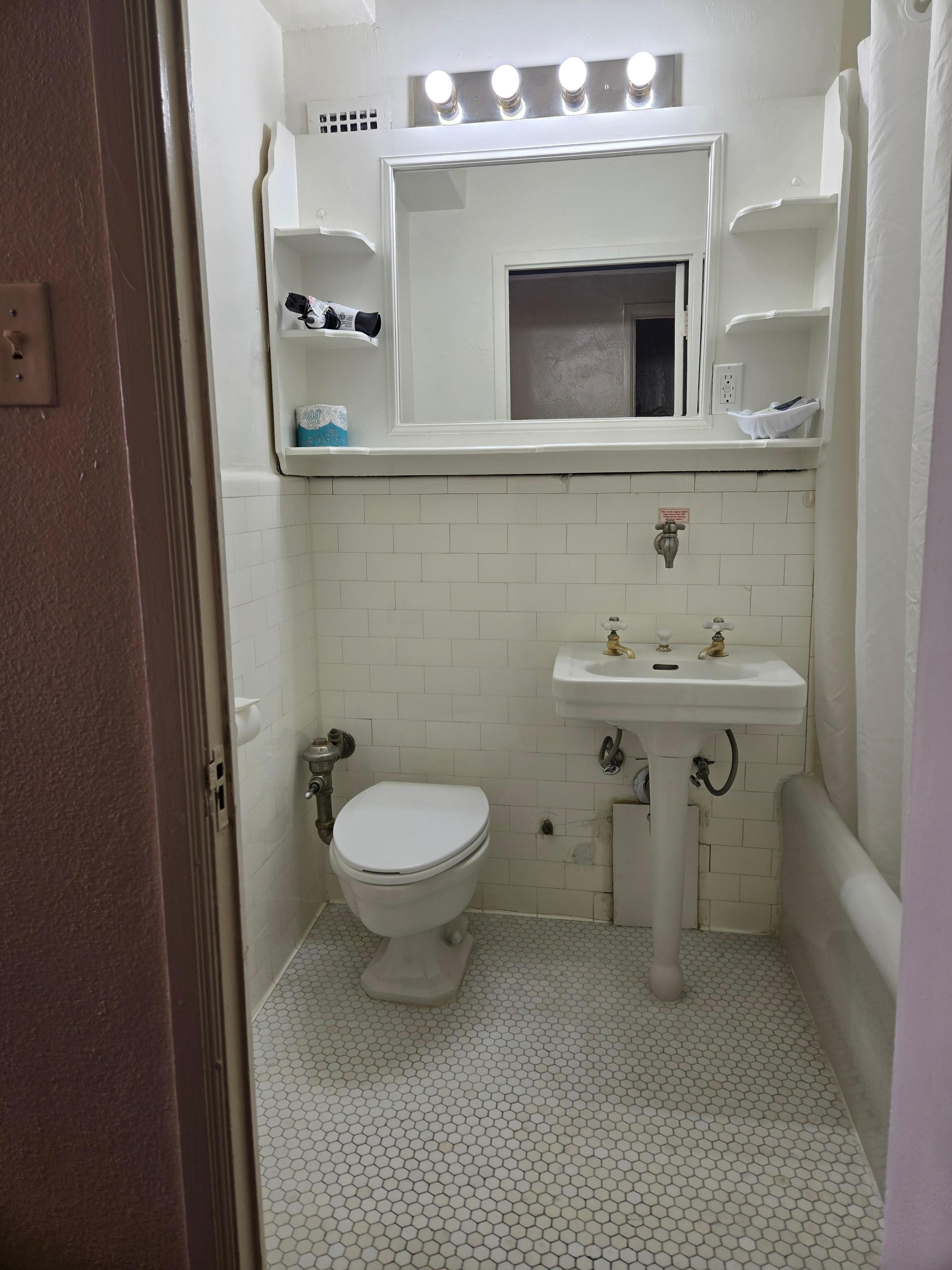 Original bathroom tiles and fixtures preserved - beautiful!!