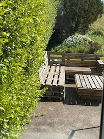 Charming little seating area for outdoor relaxation.