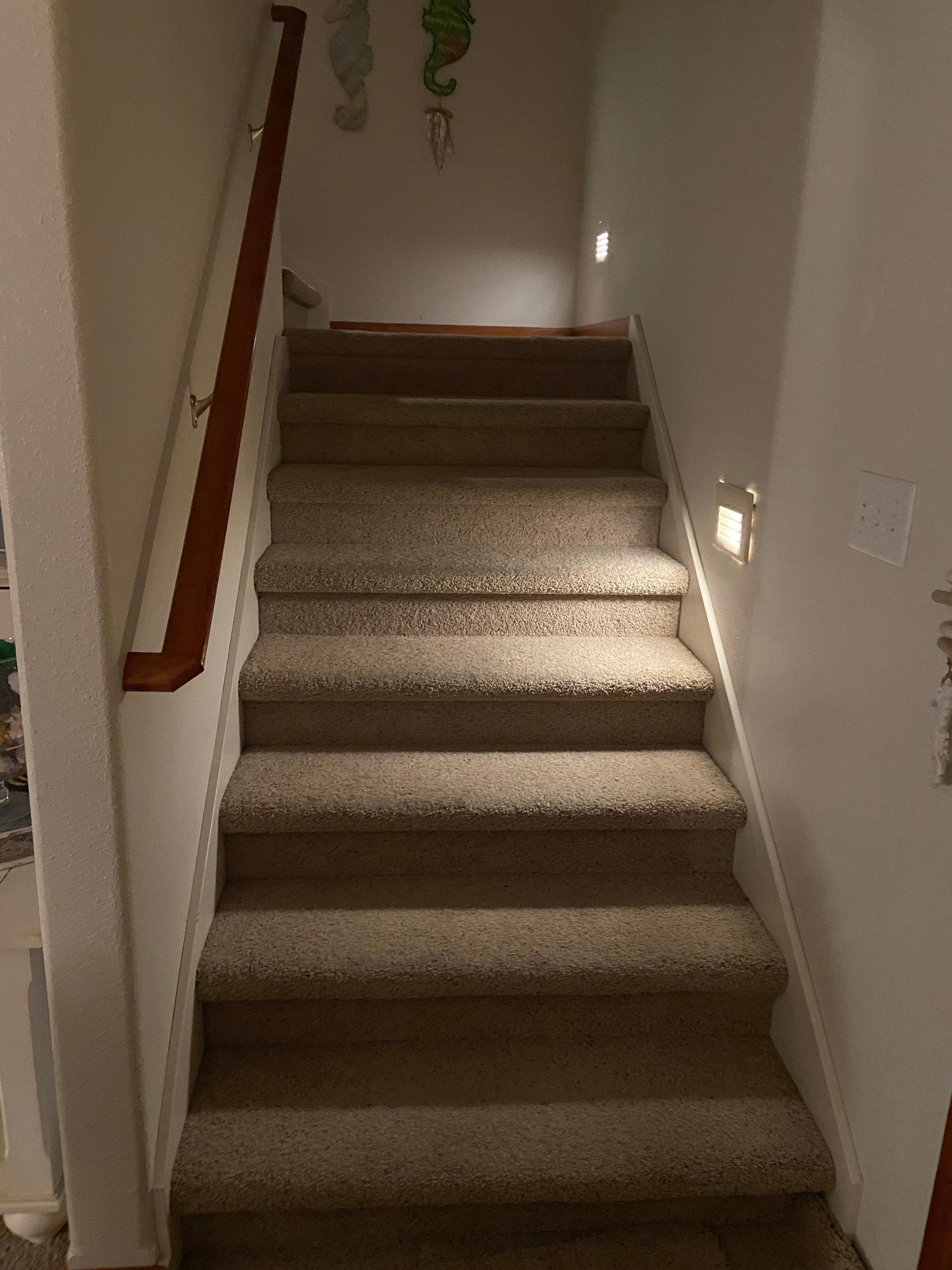 Three floors with well lit (but not screaming bright) stairs. This is from level two (main floor) to level three (great views, and a large living area).