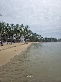 The beach its next to a river which is why it dark but is clean