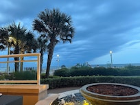 Watching the storm  roll in from a chair by the indoor pool