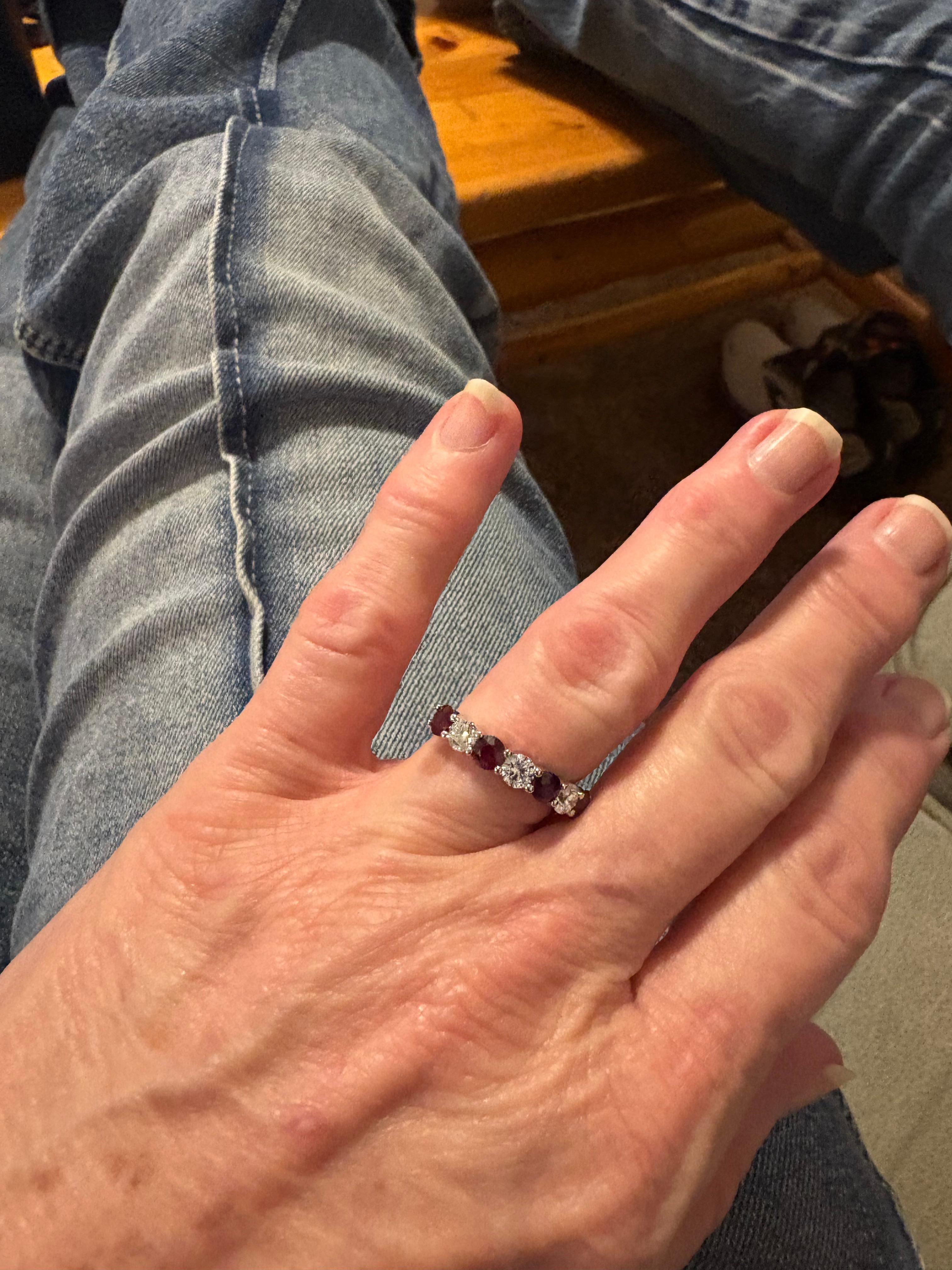 Us sitting 🪑 n the comfy couch adoring my wedding ring.. the condo was very cozy.. 