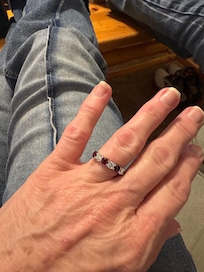 Us sitting 🪑 n the comfy couch adoring my wedding ring.. the condo was very cozy..