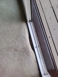 Carpet is rolled up on the edges in the living room