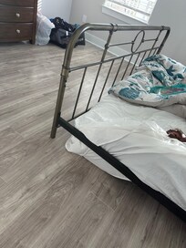 The downstairs bedroom had a bed frame without a box spring, which caused a wavy pattern in the mattress. The bed was extremely low to the ground, very uncomfortable, and unsuitable for sleeping.