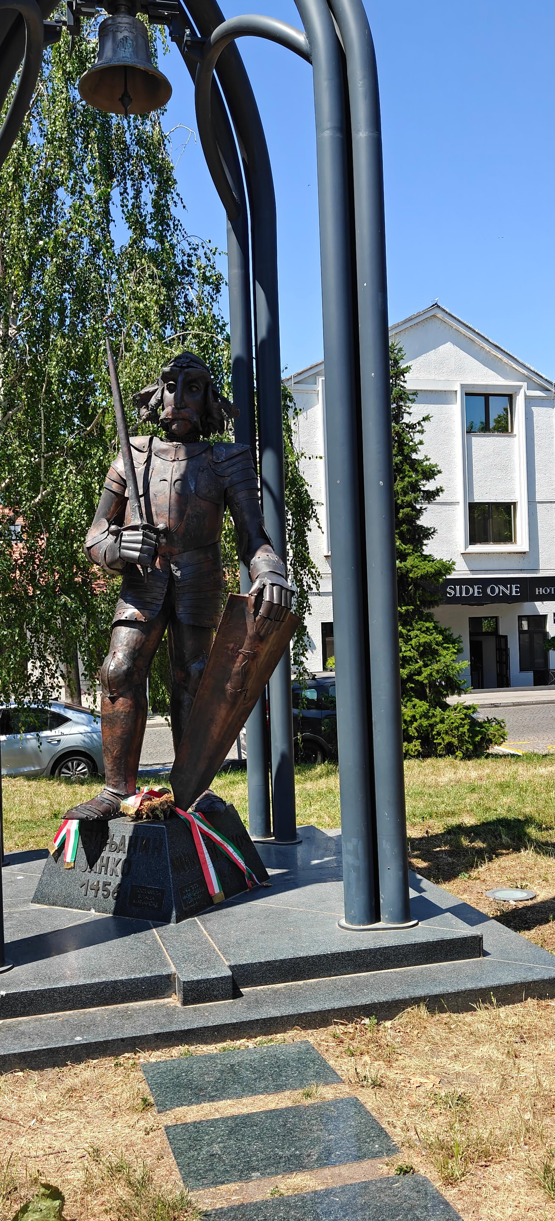 Hunyadi János with the hotel in the background 