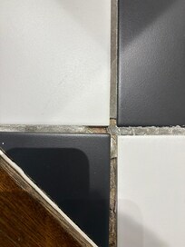 Missing grout on floor tiles