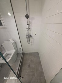 No where to put your soap, shampoo or anything but the floor.