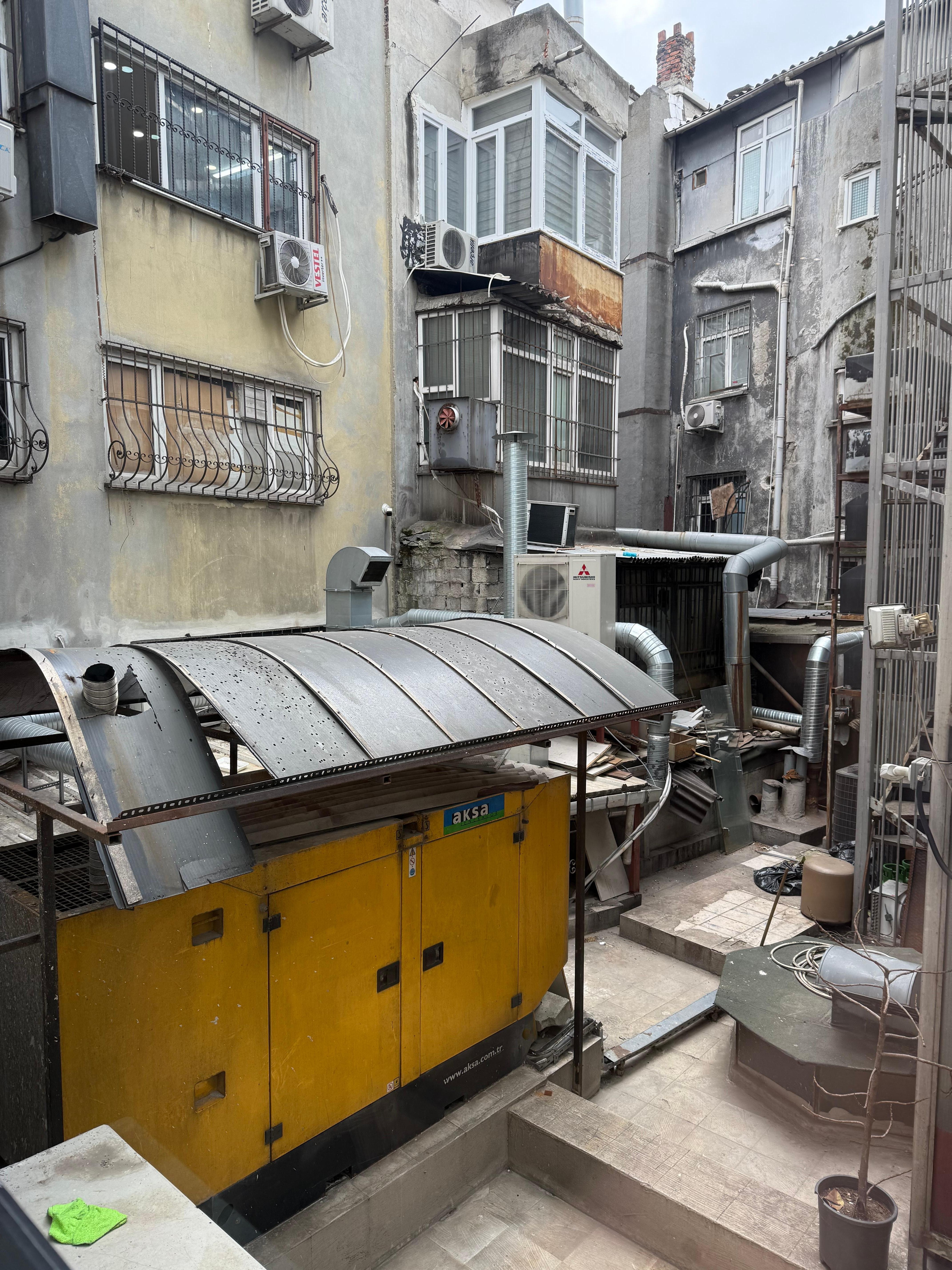 My window view with a huge generator beside 