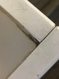 Sand and dirt in corners of both beds