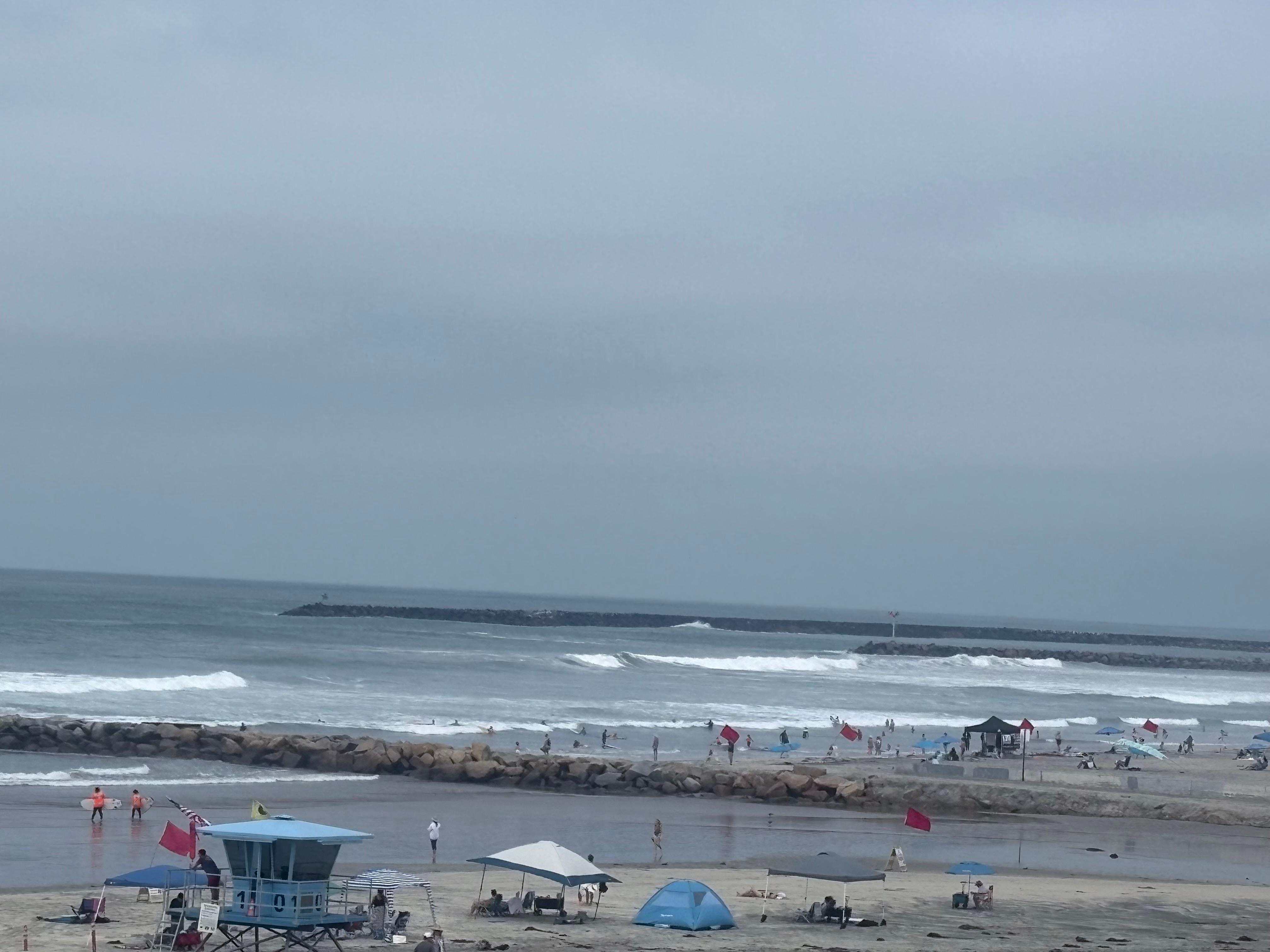A less crowded stretch of beach, with lifeguard, is next to and in front of the complex. 